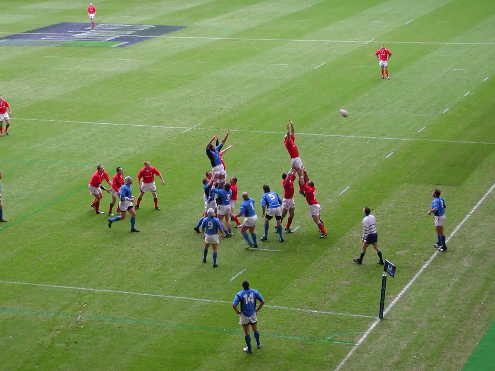 A rugby lineout, both packs jumping for the ball